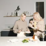 Women cooking and enjoying pasta