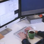 Man typing on a computer