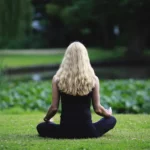 Woman meditating in lotus position