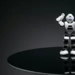White Angry Robot Toy on Round Black Table