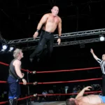 Wrestler jumping on ring
