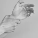 Grayscale Photograph of Mans Hands